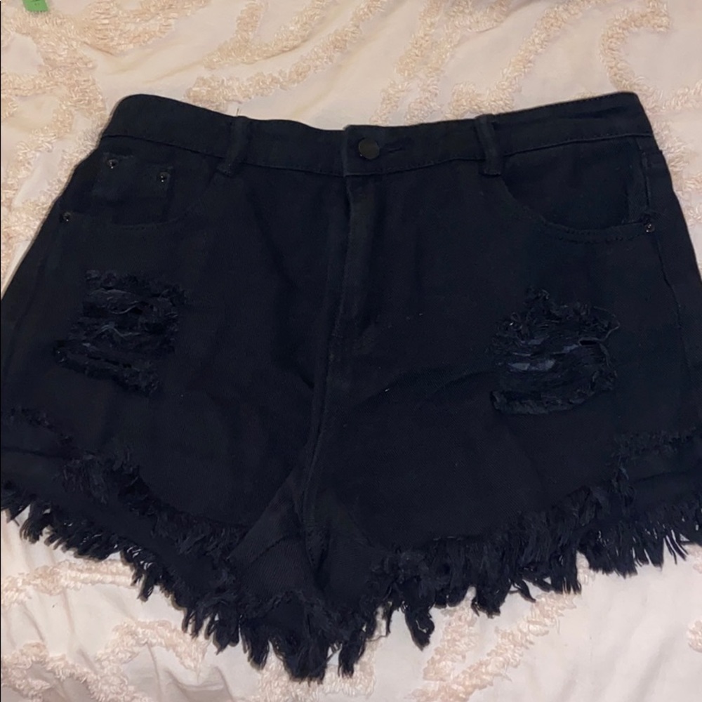 Distressed black jean shorts